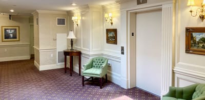 Interior hallway with seating and artwork