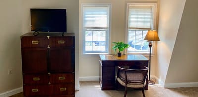Cozy resident room with desk and TV