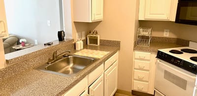 Bright kitchen area with modern appliances