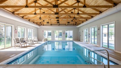Indoor swimming pool area with natural light