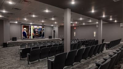 Interior view of a theater room with seating.