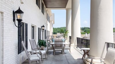 Outdoor seating area with chairs and plants