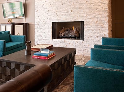 Cozy common area with comfortable seating and fireplace