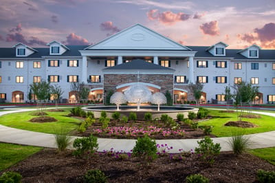 Facade of Grand Village at Clear Creek with landscaped gardens