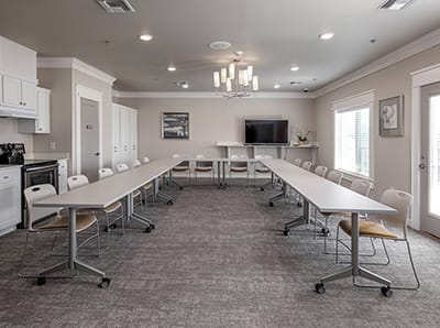 Modern conference room setup with tables and chairs