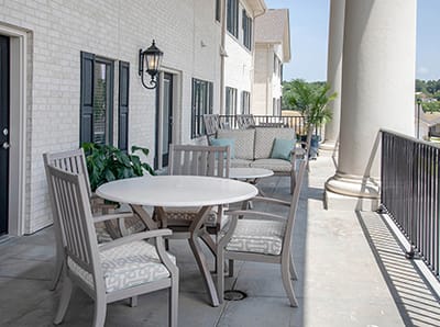 Patio area with outdoor furniture and greenery