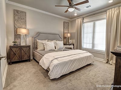 Bright, well-decorated private resident room with bed
