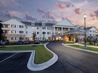 Exterior view of Grand Village at Clear Creek at sunset