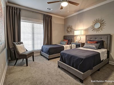 Cozy shared bedroom with two beds and decor