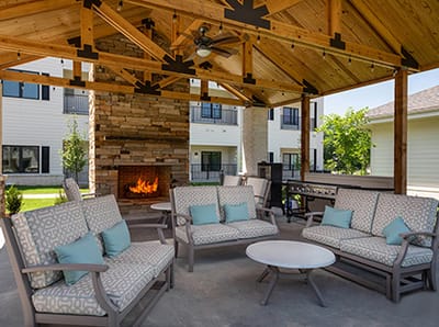 Outdoor seating area under a wooden pavilion