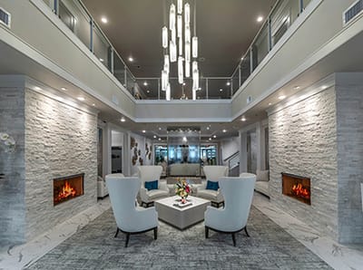 Bright common area with seating and decorative lighting