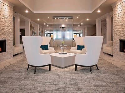 Bright interior common area with comfortable chairs and decor