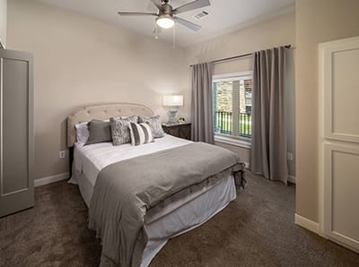 Well-decorated private room with a bed and window