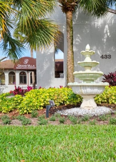 Exterior view of Grand Villa with fountain and landscaping