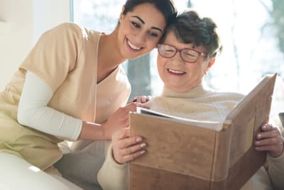 Caregiver and resident enjoying a moment together