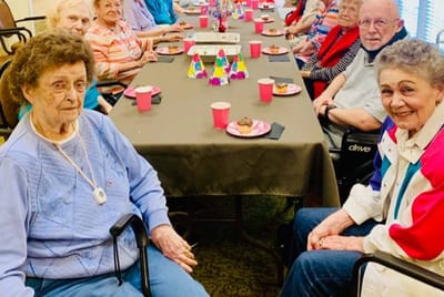 Residents enjoying a social gathering with snacks