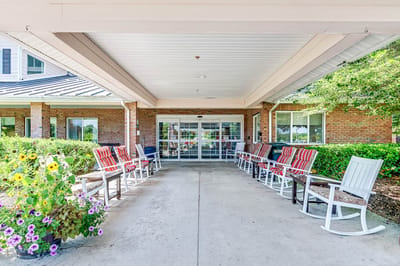 Entrance with rocking chairs and flowers