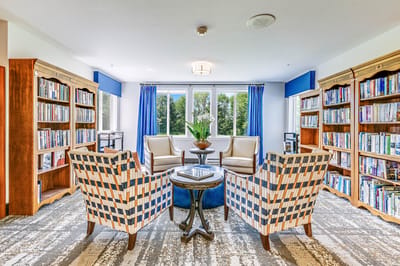 Cozy reading area with bookshelves and seating