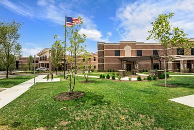 Exterior view of assisted living facility with landscaping