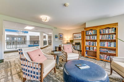 Cozy common area with seating and bookshelves