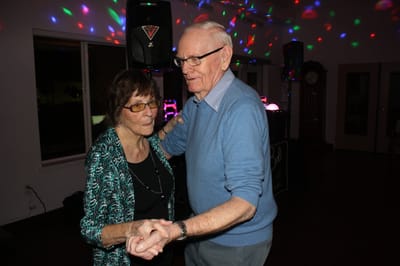 Couple dancing at a facility event