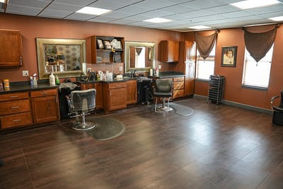 Interior view of a salon with styling chairs and mirrors