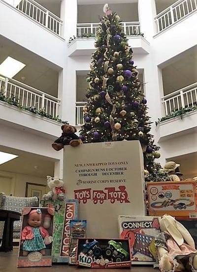 Holiday tree with presents in a common area
