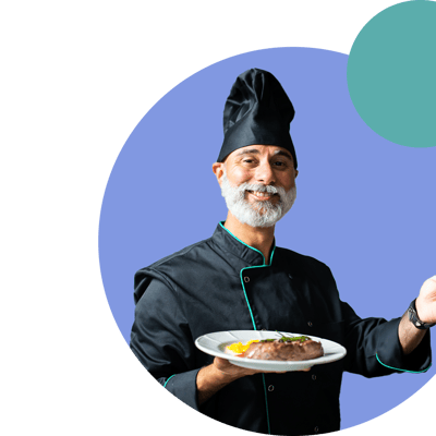 Chef presenting a gourmet meal in a modern kitchen