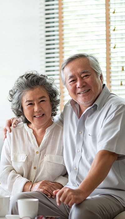 A happy senior couple posing together indoors