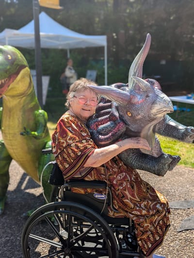 Resident enjoying an outdoor event with fun decorations