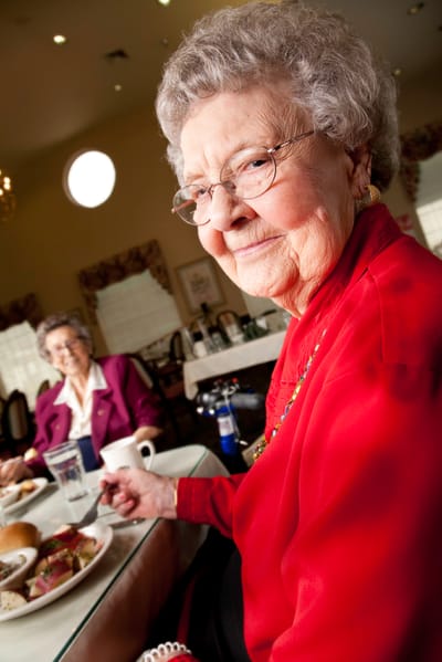 Residents enjoying a meal in the dining area