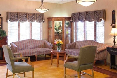 Cozy common area with comfortable seating and flowers