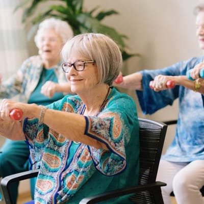 Residents participating in an exercise activity in a bright room