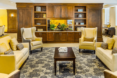 Comfortable common area with seating and an aquarium