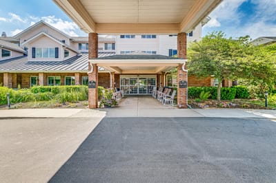 Entrance of Solstice Senior Living at Bangor with rocking chairs