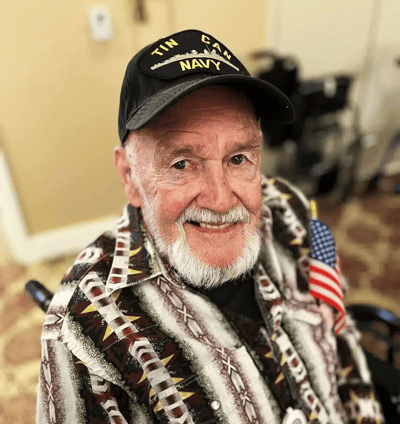 Senior resident smiling in a colorful shirt