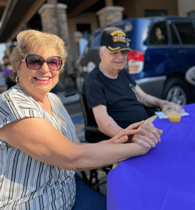 Residents enjoying a sunny day outdoors at an event