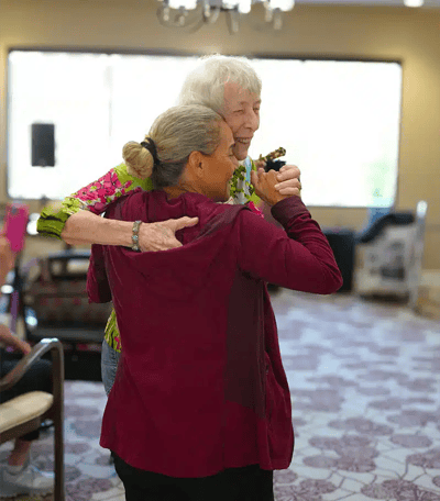 Residents enjoying a dance in the common area