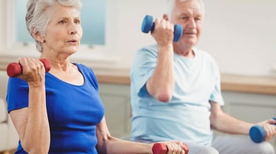 Residents participating in an exercise activity with weights