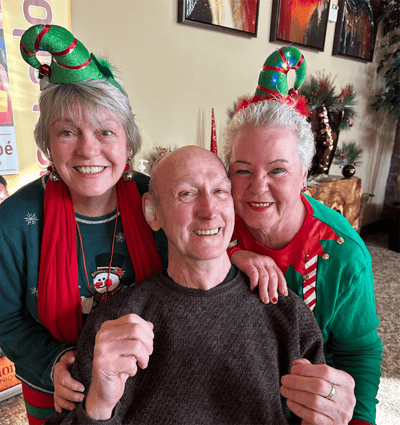 Residents celebrating with staff during a festive event