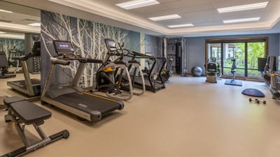 A well-equipped exercise room with multiple machines