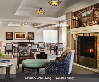 Bright common area with seating and fireplace