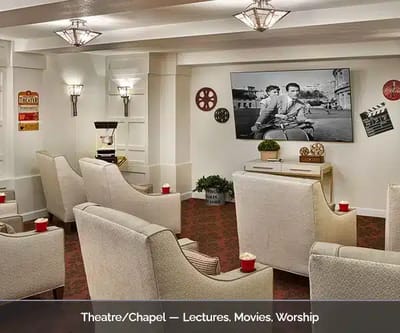 Theatre/church area with comfortable seating and a large screen