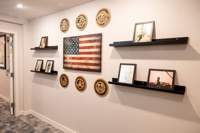 Decorative wall with an American flag and historical photos