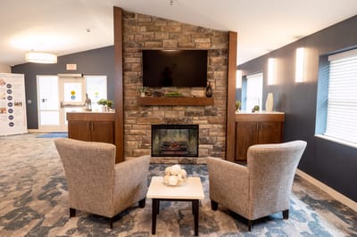 Cozy common area with seating and fireplace