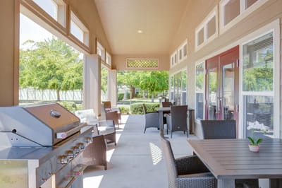 Patio area with outdoor seating and grill station