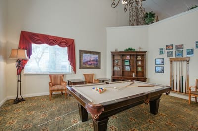 Common area with a pool table and seating