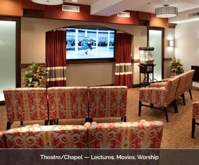 Interior of a cozy theater/church area with seating