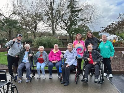 Residents posing together in an outdoor setting