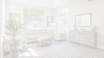 Bright common area with seating and natural light